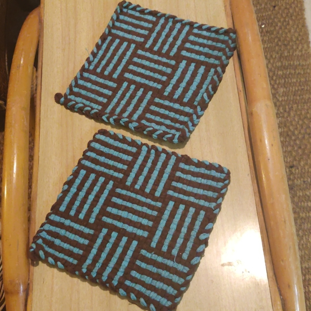 Two hand crafted trivets/potholders